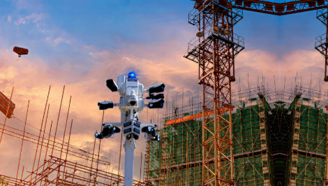 Outdoor security cameras monitoring a construction site to prevent theft and unauthorized access.