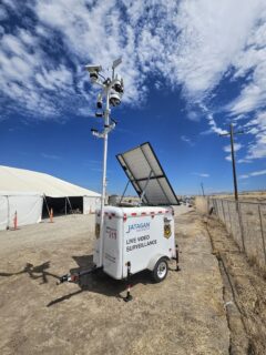 Jatagan Solar Mobile Guard surveillance unit with mast-mounted AI cameras and solar panel at a construction site